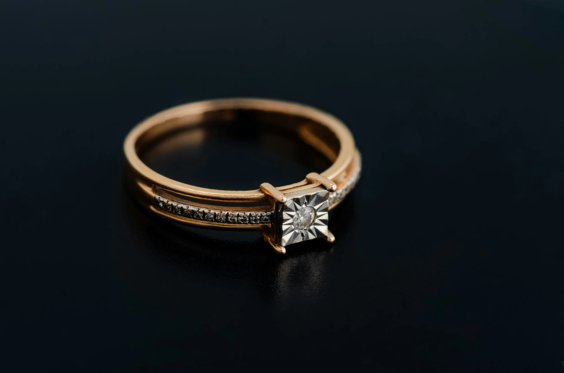 a close up of a ring on a black surface